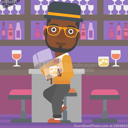 Image of Man sitting at bar.