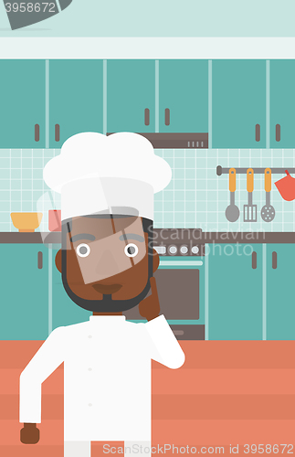 Image of Chef pointing forefinger up.