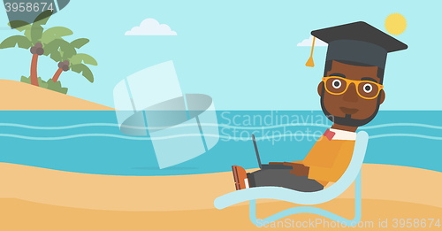 Image of Graduate lying on chaise lounge with laptop.