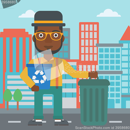 Image of Man with recycle bins.