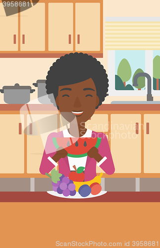 Image of Woman eating watermelon.