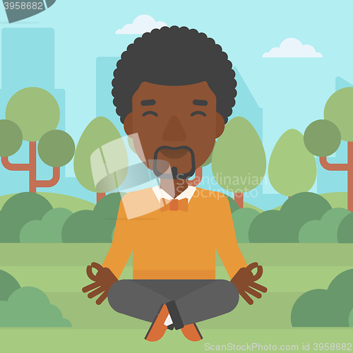 Image of Businessman meditating in lotus pose.