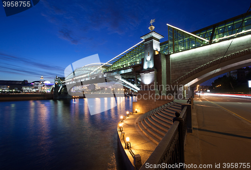 Image of Night landscape with the illuminated bridge and river. Moscow, R