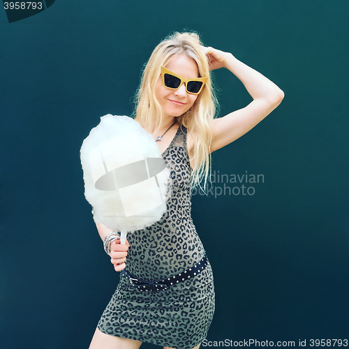 Image of Pretty young woman with cotton candy