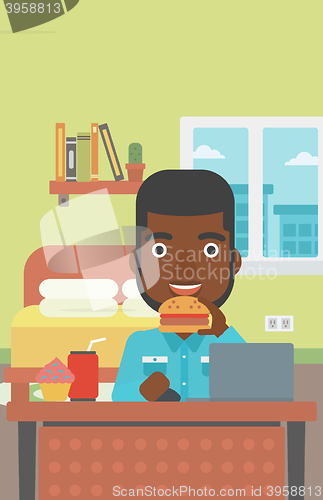 Image of Man eating hamburger. 