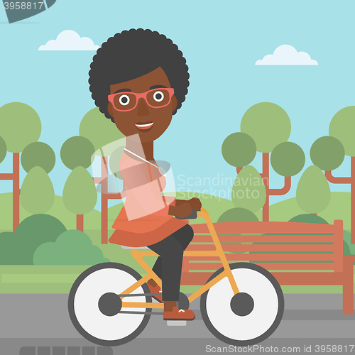 Image of Woman riding bicycle.