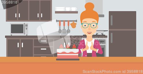 Image of Woman looking at cake.