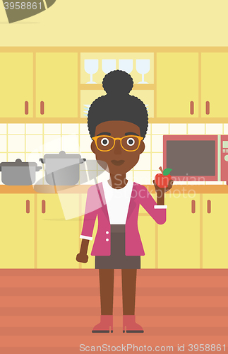 Image of Woman holding apple.