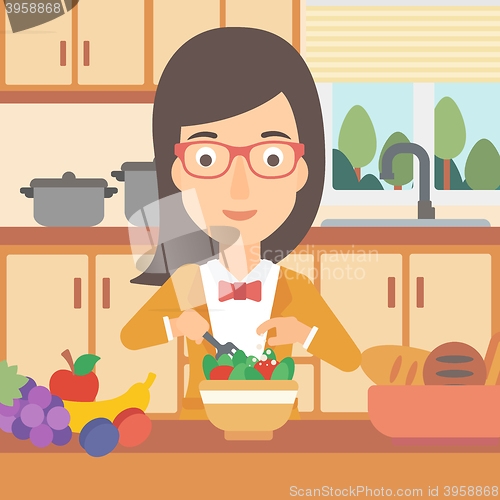 Image of Woman cooking vegetable salad.