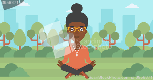 Image of Business woman meditating in lotus pose.