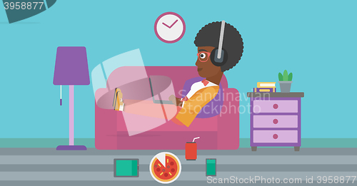 Image of Woman lying on sofa with many gadgets.