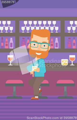 Image of Man sitting at bar.