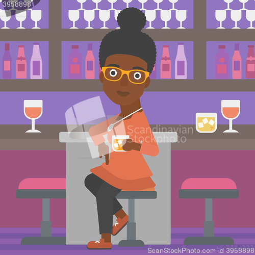 Image of Woman sitting at bar.