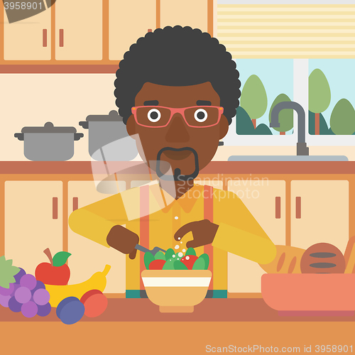 Image of Man cooking vegetable salad.