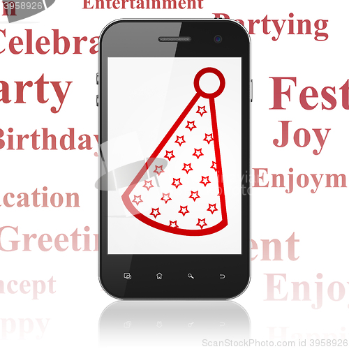 Image of Holiday concept: Smartphone with Party Hat on display