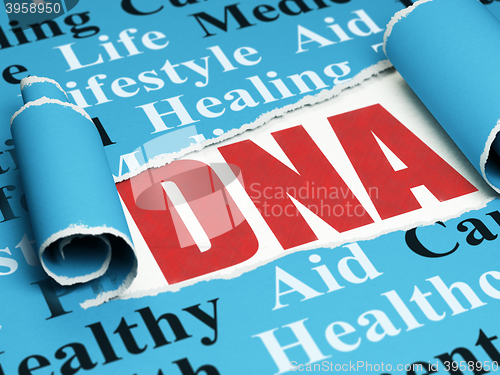 Image of Medicine concept: red text DNA under the piece of  torn paper