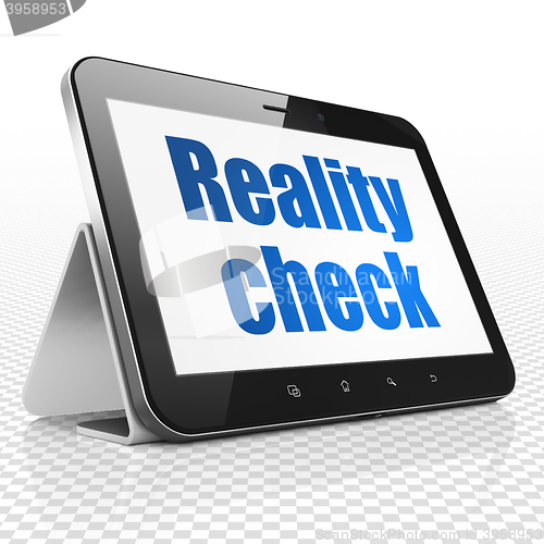 Image of Business concept: Tablet Computer with Reality Check on display
