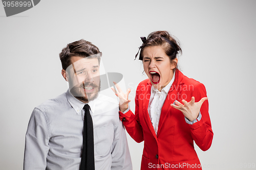 Image of The business man and woman communicating on a gray background