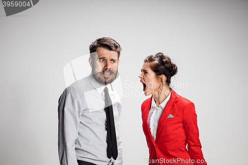 Image of The business man and woman communicating on a gray background