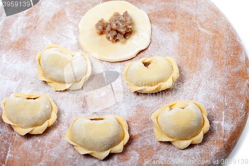 Image of Homemade ravioli on kitchen board