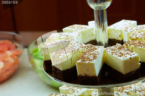 Image of Dessert table for party. akes and sweetness. Shallow dof