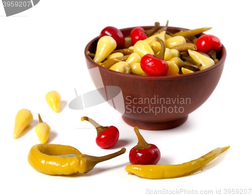 Image of Mix of hot turkish pickled peppers in ceramic bowl