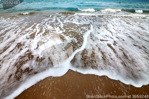 Image of Sea beach with waves in autumn