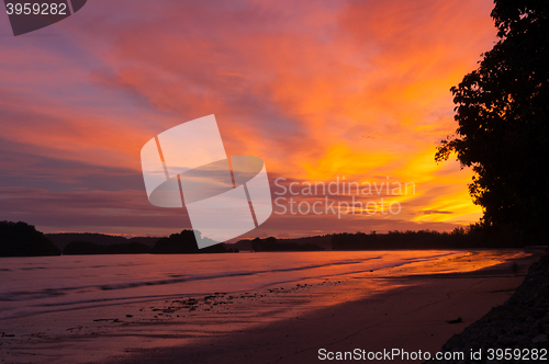 Image of The sunset over the sea with yellow and orange sky