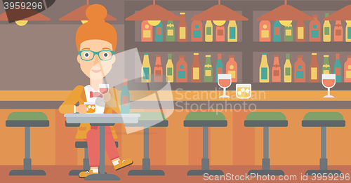 Image of Woman sitting at bar.