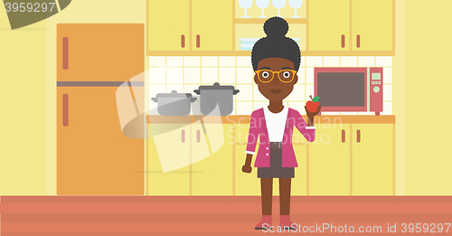 Image of Woman holding apple.