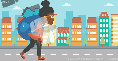 Image of Woman with backpack full of devices.