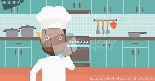 Image of Chef pointing forefinger up.