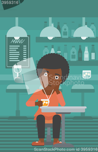 Image of Woman sitting at bar.