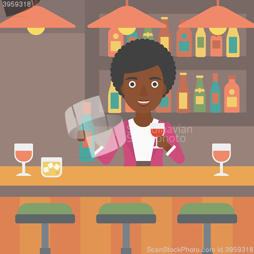 Image of Bartender standing at the bar counter.