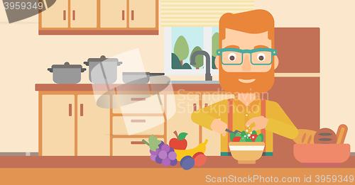 Image of Man cooking vegetable salad.