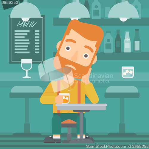 Image of Man sitting at bar.