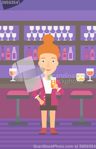 Image of Woman holding glass of juice.