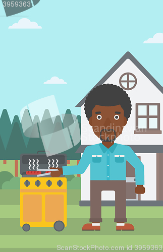 Image of Man preparing barbecue.