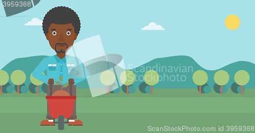 Image of Man with plant and wheelbarrow.