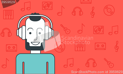 Image of Man listening to music.