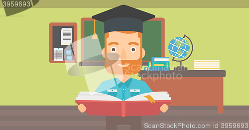 Image of Man in graduation cap holding book.