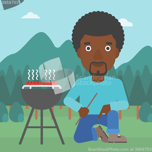 Image of Man preparing barbecue.