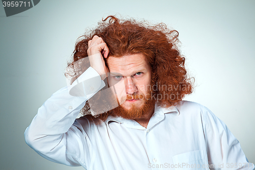 Image of Stressed businessman with a headache