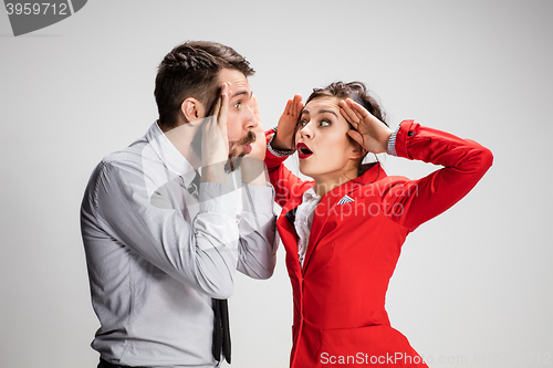 Image of The business man and woman communicating on a gray background