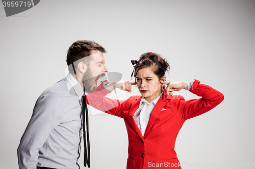 Image of The business man and woman communicating on a gray background