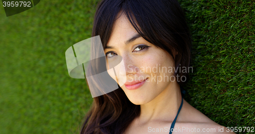 Image of Pretty woman wearing top with green strap