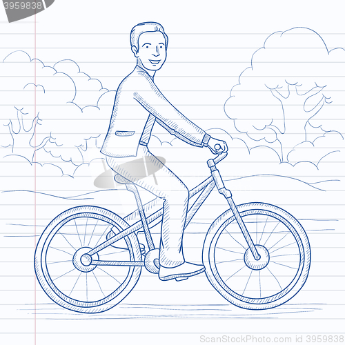 Image of Man riding bicycle.