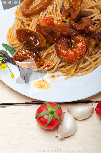 Image of Italian seafood spaghetti pasta on red tomato sauce 