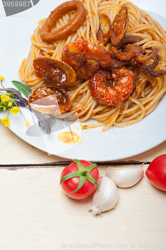 Image of Italian seafood spaghetti pasta on red tomato sauce 