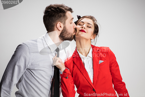 Image of The business man and woman communicating on a gray background
